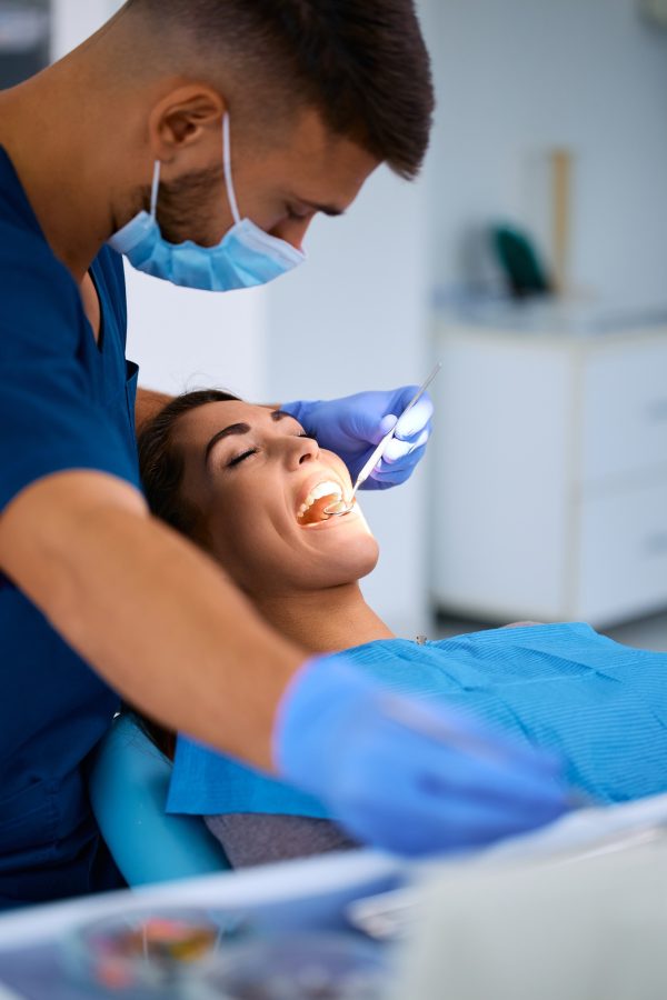 young-woman-having-dental-exam-at-dentist-s-office-